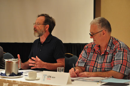 Michael McBane of the Canadian Health Coalition speaks to the Canadian Health Professionals Secretariat meeting Thursday. Seated next to him is NUPGE's Len Bush.