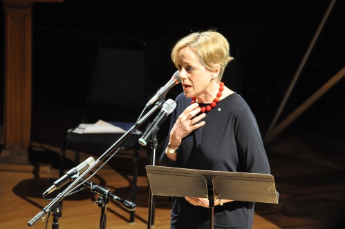 Actress Fiona Reid asks the audience to sign the Ontario Health Coalition postcards on contracting out of hospital services.
