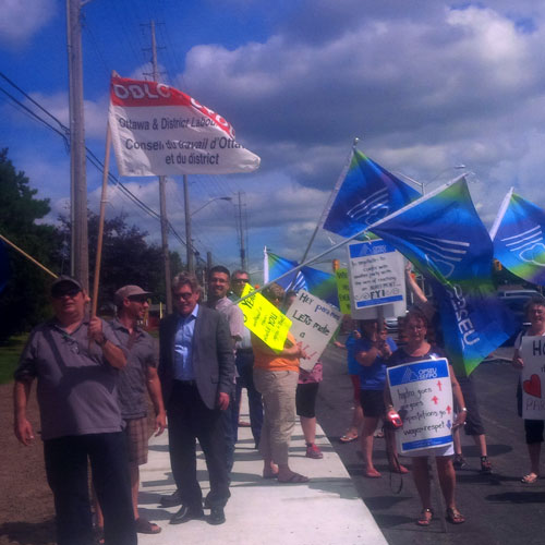 Photograph of demonstration outside of ParaMed's Ottawa offices. Support came from across the region as ParaMed's Renfrew workers travelled to Ottawa to picket the company's offices. The workers will almost certainly be on strike next Tuesday.