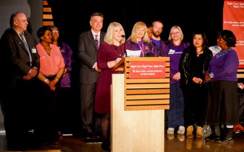 Photograph of former Health Minister Deb Matthews with Finance Minister Charles Sousa announcing the breakthrough increase for PSWs in April.